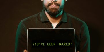 Photo by Saksham Choudhary from Pexels: https://www.pexels.com/photo/man-holding-laptop-computer-with-both-hands-2036656/