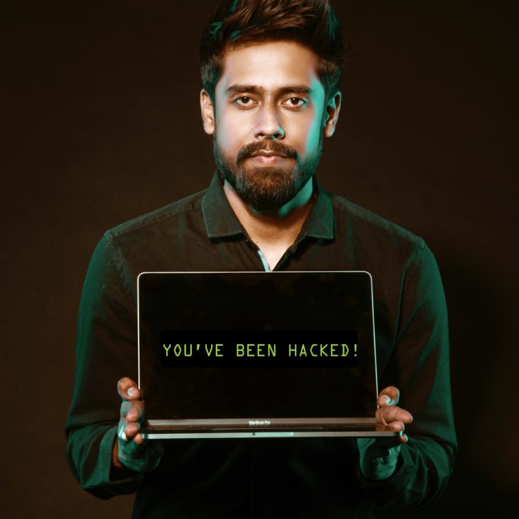 Photo by Saksham Choudhary from Pexels: https://www.pexels.com/photo/man-holding-laptop-computer-with-both-hands-2036656/