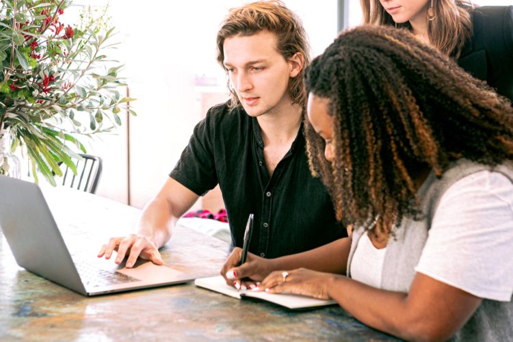 Photo by Canva Studio from Pexels: https://www.pexels.com/photo/man-working-on-laptop-while-woman-takes-notes-3153199/