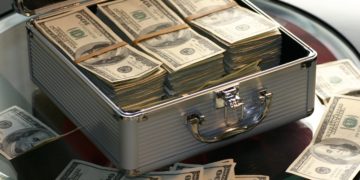 Photo by Pixabay from Pexels: https://www.pexels.com/photo/hard-cash-on-a-briefcase-259027/
