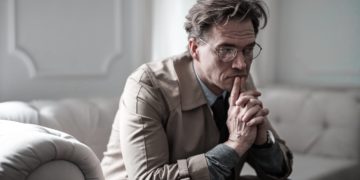 Photo by Andrea Piacquadio from Pexels: https://www.pexels.com/photo/man-in-brown-suit-jacket-sitting-on-white-sofa-3760774/