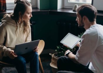 Photo by cottonbro studio from Pexels: https://www.pexels.com/photo/photo-of-couple-talking-while-holding-laptop-and-ipad-4065158/
