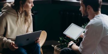 Photo by cottonbro studio from Pexels: https://www.pexels.com/photo/photo-of-couple-talking-while-holding-laptop-and-ipad-4065158/