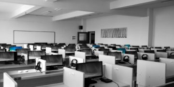 Photo by Pixabay from Pexels: https://www.pexels.com/photo/gray-wooden-computer-cubicles-inside-room-267507/