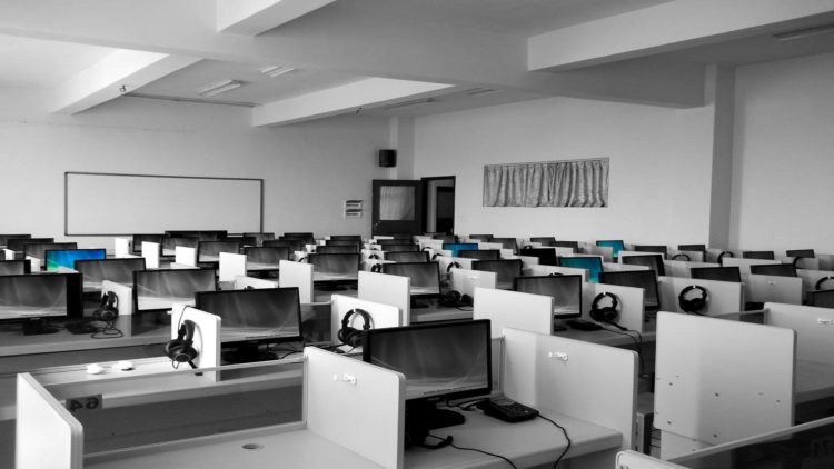 Photo by Pixabay from Pexels: https://www.pexels.com/photo/gray-wooden-computer-cubicles-inside-room-267507/