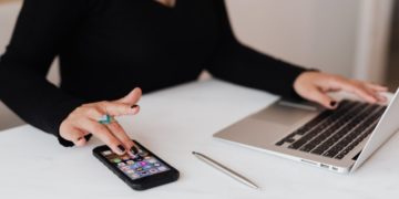 Photo by Karolina Grabowska from Pexels: https://www.pexels.com/photo/crop-woman-using-smartphone-and-laptop-during-work-in-office-4467737/