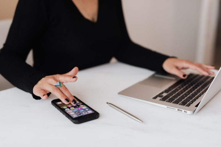 Photo by Karolina Grabowska from Pexels: https://www.pexels.com/photo/crop-woman-using-smartphone-and-laptop-during-work-in-office-4467737/