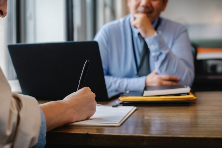 Photo by Sora Shimazaki from Pexels: https://www.pexels.com/photo/woman-filling-job-application-form-in-office-with-boss-5668858/