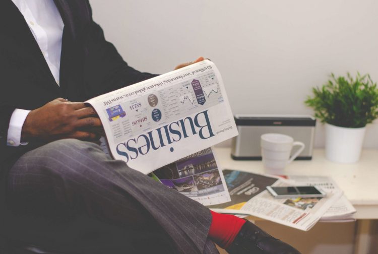 Photo by nappy from Pexels: https://www.pexels.com/photo/man-reading-newspaper-while-sitting-near-table-with-smartphone-and-cup-935979/