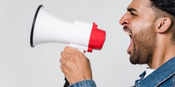 Photo by Sora Shimazaki from Pexels: https://www.pexels.com/photo/man-in-blue-denim-jacket-holding-a-megaphone-5935755/