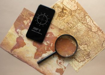 Photo by Monstera from Pexels: https://www.pexels.com/photo/loupe-and-smartphone-with-compass-on-maps-7412068/