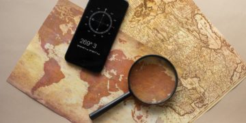 Photo by Monstera from Pexels: https://www.pexels.com/photo/loupe-and-smartphone-with-compass-on-maps-7412068/