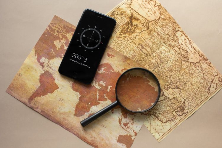 Photo by Monstera from Pexels: https://www.pexels.com/photo/loupe-and-smartphone-with-compass-on-maps-7412068/