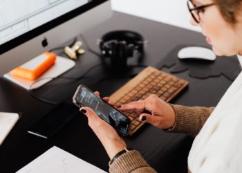 Photo by Karolina Grabowska: https://www.pexels.com/photo/crop-woman-using-smartphone-while-working-at-computer-4476389/