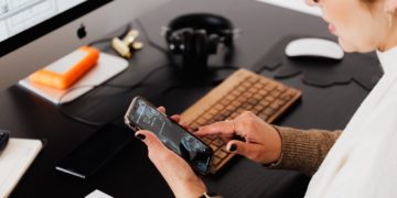 Photo by Karolina Grabowska: https://www.pexels.com/photo/crop-woman-using-smartphone-while-working-at-computer-4476389/