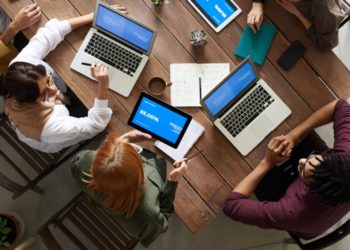 Photo by fauxels from Pexels: https://www.pexels.com/photo/top-view-photo-of-group-of-people-using-macbook-while-discussing-3182773/