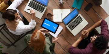 Photo by fauxels from Pexels: https://www.pexels.com/photo/top-view-photo-of-group-of-people-using-macbook-while-discussing-3182773/