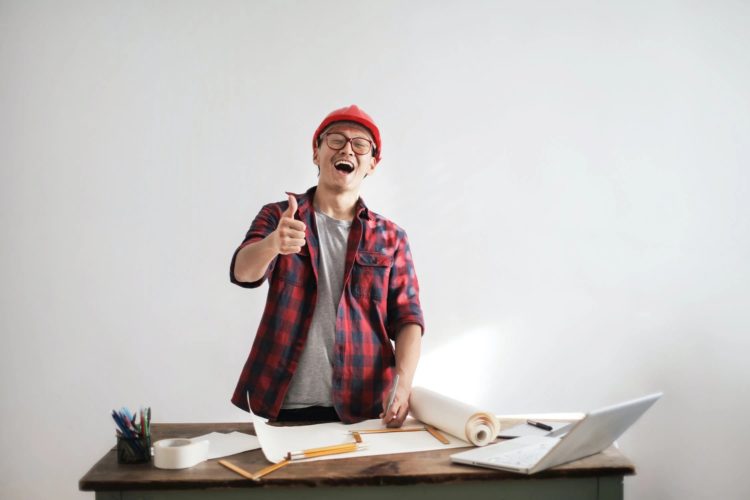 Photo by Andrea Piacquadio from Pexels: https://www.pexels.com/photo/laughing-male-constructor-showing-thumb-up-at-working-desk-3760613/