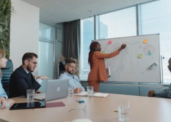 Photo by Tima Miroshnichenko from Pexels: https://www.pexels.com/photo/woman-showing-her-presentation-by-writing-on-a-white-board-5439487/