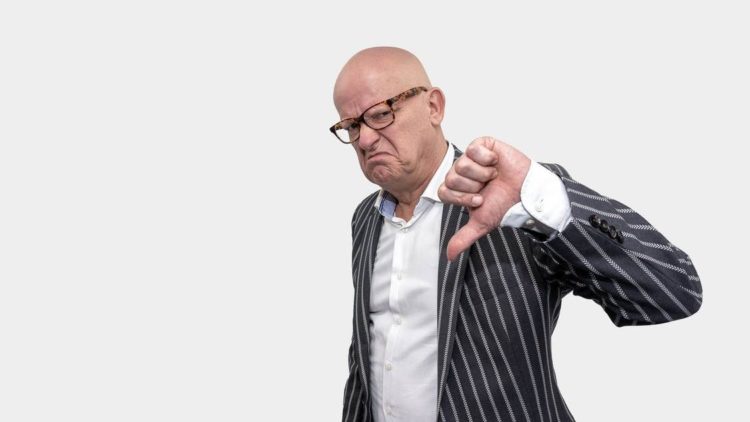 Photo by Mike van Schoonderwalt from Pexels: https://www.pexels.com/photo/a-man-flashing-the-thumbs-down-sign-5511613/