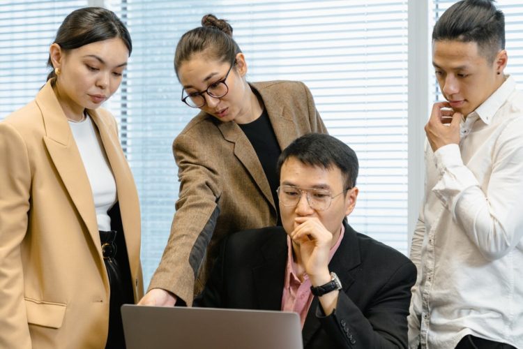Photo by MART PRODUCTION from Pexels: https://www.pexels.com/photo/people-in-the-office-looking-at-the-laptop-screen-7643755/