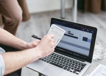 Photo by Mikhail Nilov from Pexels: https://www.pexels.com/photo/person-holding-black-pen-and-notepad-7735700/