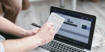 Photo by Mikhail Nilov from Pexels: https://www.pexels.com/photo/person-holding-black-pen-and-notepad-7735700/