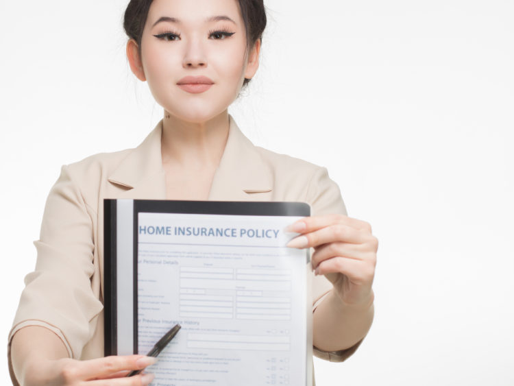 Photo by Mikhail Nilov from Pexels: https://www.pexels.com/photo/woman-in-corporate-attire-holding-a-home-insurance-policy-7736070/