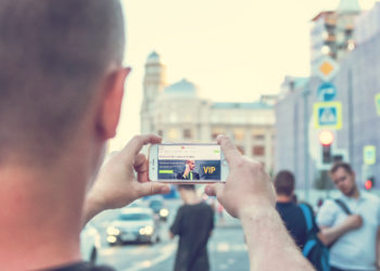 Photo by Artem Beliaikin from Pexels: https://www.pexels.com/photo/man-standing-near-outdoor-while-holding-white-smartphone-2433163/
