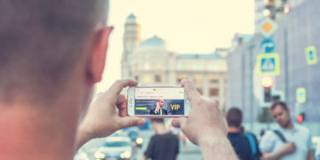Photo by Artem Beliaikin from Pexels: https://www.pexels.com/photo/man-standing-near-outdoor-while-holding-white-smartphone-2433163/