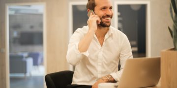 Photo by Andrea Piacquadio from Pexels: https://www.pexels.com/photo/smiling-formal-male-with-laptop-chatting-via-phone-3760263/