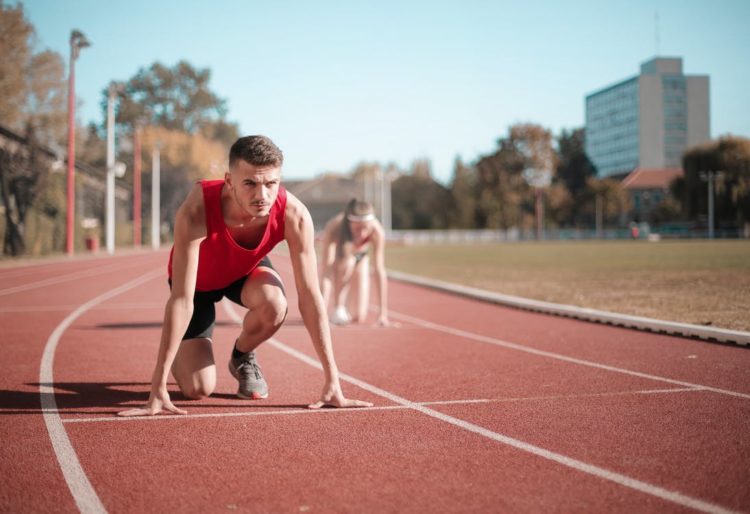 Photo by Andrea Piacquadio from Pexels: https://www.pexels.com/photo/strong-sportsmen-ready-for-running-on-stadium-3764011/