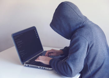 Photo by Nikita Belokhonov from Pexels: https://www.pexels.com/photo/anonymous-hacker-with-on-laptop-in-white-room-5829726/