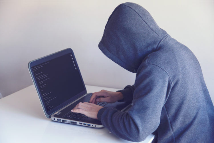 Photo by Nikita Belokhonov from Pexels: https://www.pexels.com/photo/anonymous-hacker-with-on-laptop-in-white-room-5829726/