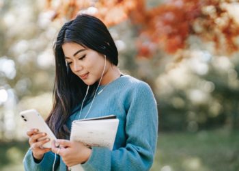 Photo by Charlotte May from Pexels: https://www.pexels.com/photo/young-cheerful-woman-listening-to-music-using-smartphone-5965926/
