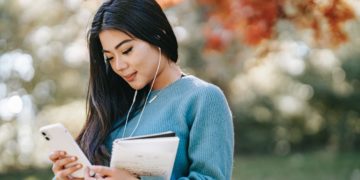 Photo by Charlotte May from Pexels: https://www.pexels.com/photo/young-cheerful-woman-listening-to-music-using-smartphone-5965926/
