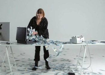 Photo by Tima Miroshnichenko from Pexels: https://www.pexels.com/photo/woman-putting-cash-money-in-a-briefcase-6266665/