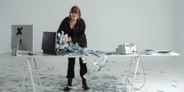 Photo by Tima Miroshnichenko from Pexels: https://www.pexels.com/photo/woman-putting-cash-money-in-a-briefcase-6266665/