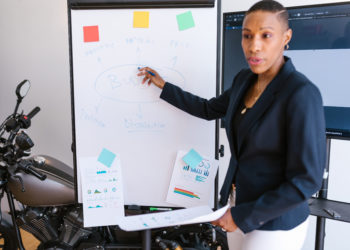 Photo by RODNAE Productions from Pexels: https://www.pexels.com/photo/woman-presenting-on-a-white-board-7414040/