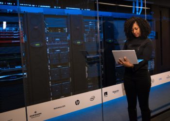 Photo by Christina Morillo from Pexels: https://www.pexels.com/photo/software-engineer-standing-beside-server-racks-1181354/