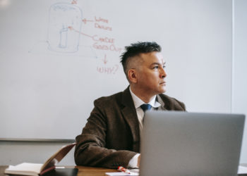 Photo by Vanessa Garcia  from Pexels: https://www.pexels.com/photo/photo-of-man-sitting-in-front-of-white-board-6326077/