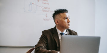 Photo by Vanessa Garcia  from Pexels: https://www.pexels.com/photo/photo-of-man-sitting-in-front-of-white-board-6326077/