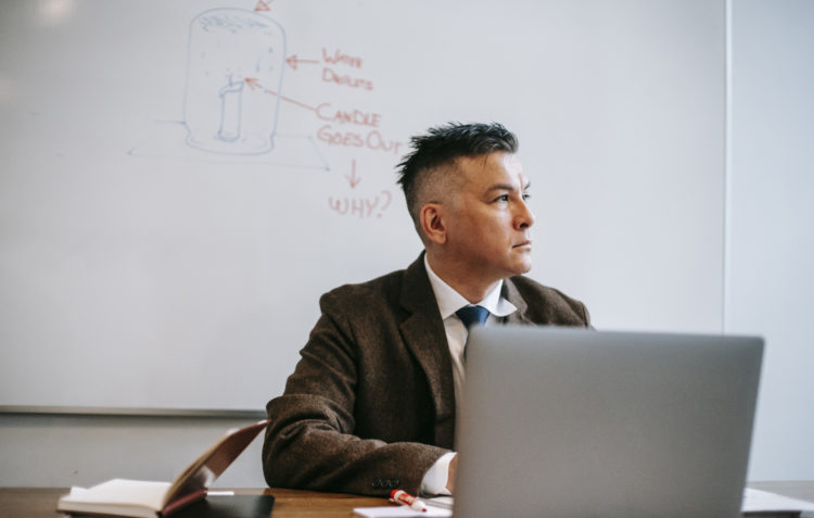 Photo by Vanessa Garcia  from Pexels: https://www.pexels.com/photo/photo-of-man-sitting-in-front-of-white-board-6326077/