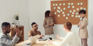 Photo by fauxels: https://www.pexels.com/photo/women-standing-beside-corkboard-3184296/