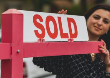 Photo by RODNAE Productions: https://www.pexels.com/photo/real-estate-agent-holding-a-signage-8293694/