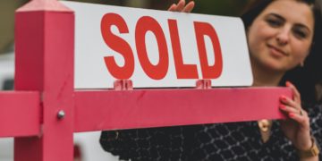 Photo by RODNAE Productions: https://www.pexels.com/photo/real-estate-agent-holding-a-signage-8293694/