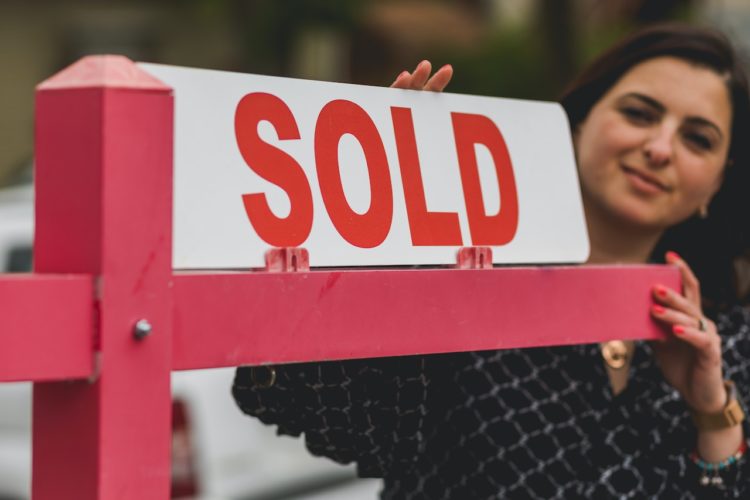Photo by RODNAE Productions: https://www.pexels.com/photo/real-estate-agent-holding-a-signage-8293694/