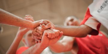 Photo by Andrea Piacquadio: https://www.pexels.com/photo/basketball-team-stacking-hands-together-3755440/