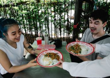 Photo by George Pak : https://www.pexels.com/photo/waiter-serving-a-fresh-meal-to-young-people-in-an-outdoor-restaurant-7969146/