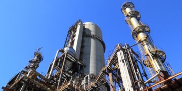 Photo by Pixabay: https://www.pexels.com/photo/low-angle-shot-of-manufacturing-plant-under-blue-sky-257700/